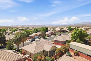 Aerial perspective of suburban area with a mountainous background