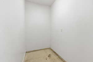 Empty room featuring baseboards