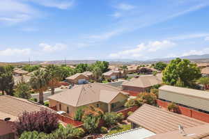 Aerial perspective of suburban area featuring a mountain backdrop
