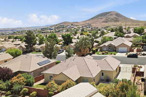 Aerial view of residential area featuring a mountain backdrop