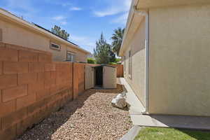 View of side of home featuring stucco siding
