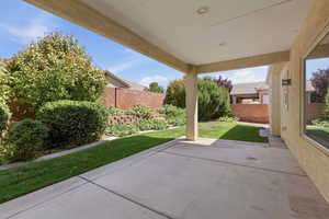 Fenced backyard featuring a patio