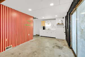 Garage with recessed lighting and a sink