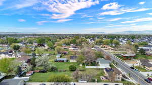 Aerial perspective of suburban area featuring a mountainous background