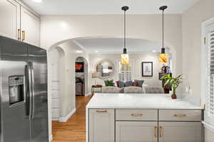 Modern day timeless kitchen design featuring a beautiful island bar.