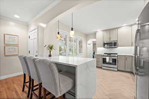 You don’t want to miss this moment—featuring a stunning waterfall island and a seamlessly designed kitchen.