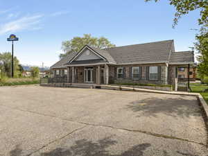 View of building exterior featuring uncovered parking