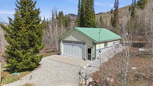Detached garage featuring a mountain view