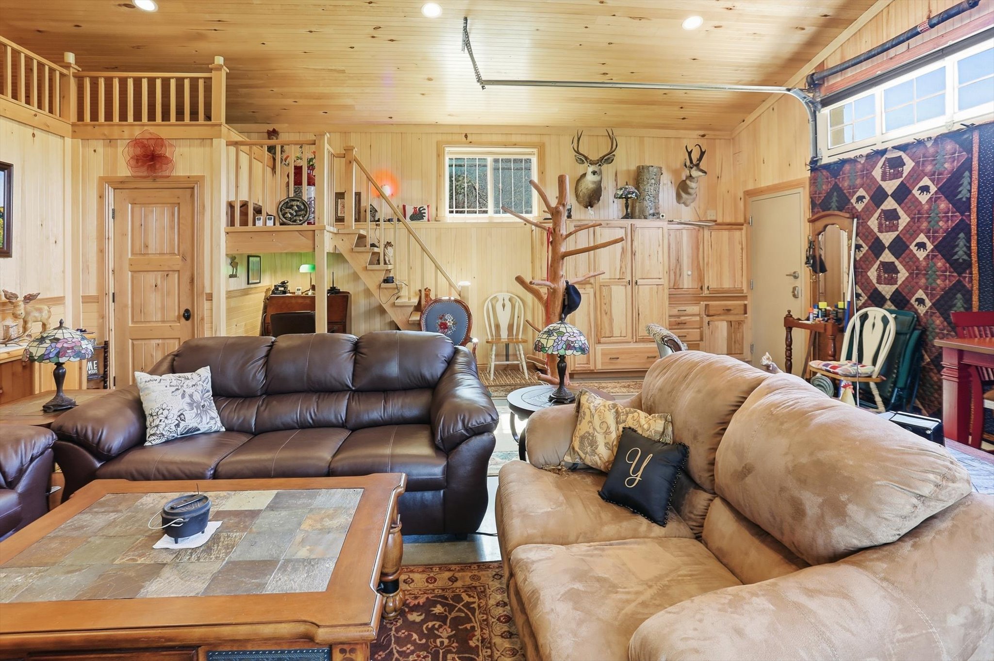 Living area with wood walls and wooden ceiling