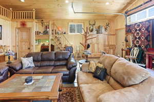 Living area with wood walls and wooden ceiling