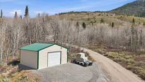Detached garage featuring driveway
