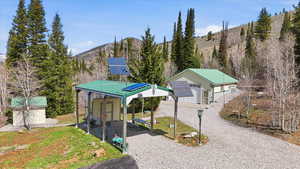 View of yard featuring a mountain view and a storage shed
