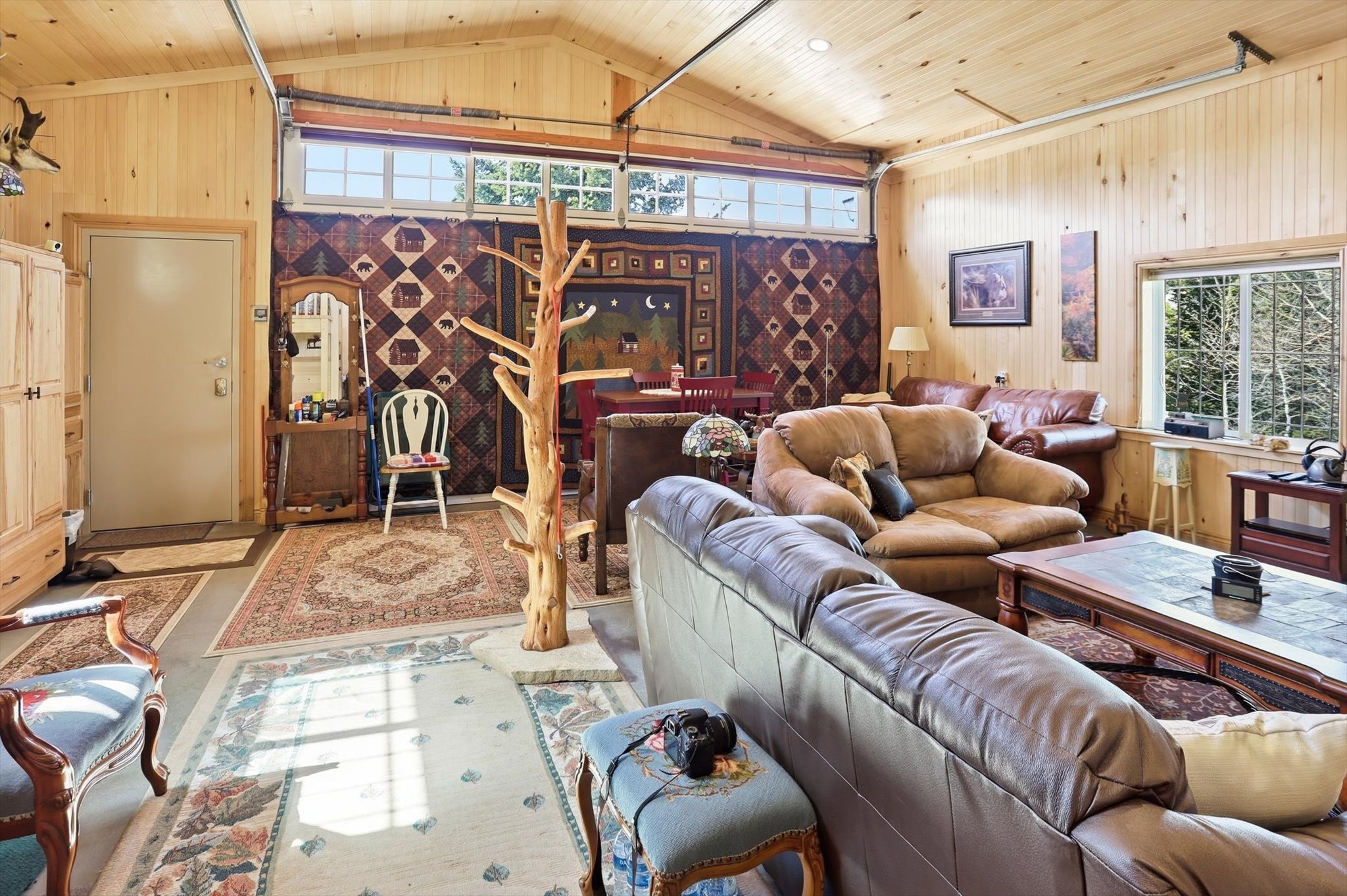 Living area with plenty of natural light and wood ceiling