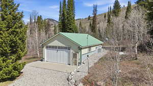 Detached garage featuring a mountain view