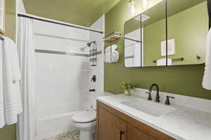 Bathroom with vanity and shower / bath combo