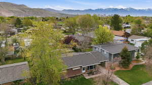 Aerial perspective of suburban area with a mountain backdrop