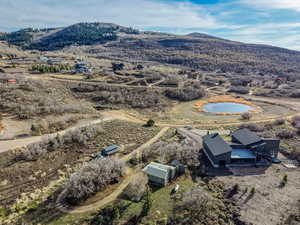 Overview of rural landscape featuring a mountainous background