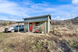 View of outbuilding with a mountain view