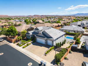 Aerial perspective of suburban area with a mountain backdrop