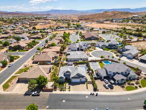 Aerial perspective of suburban area with a mountain backdrop