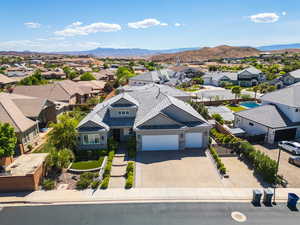 Aerial view of residential area featuring a mountainous background