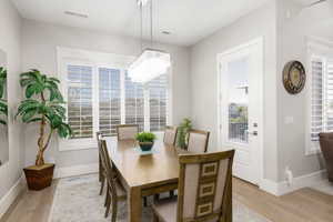 Dining space featuring light wood finished floors and baseboards