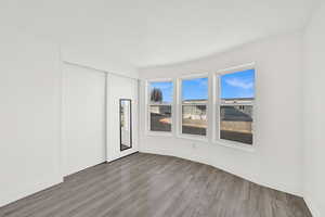 Unfurnished room with wood finished floors