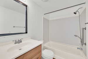 Full bathroom featuring vanity and shower / tub combination