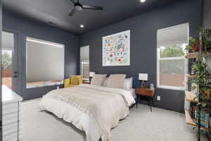 Carpeted bedroom featuring access to outside, ceiling fan, and recessed lighting