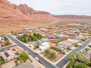 Aerial perspective of suburban area featuring a mountain backdrop