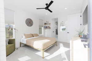 Bedroom featuring ensuite bath, light colored carpet, a ceiling fan, and recessed lighting