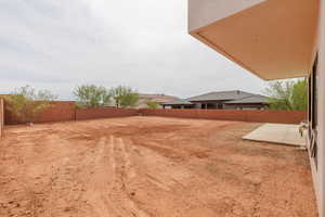 View of fenced backyard