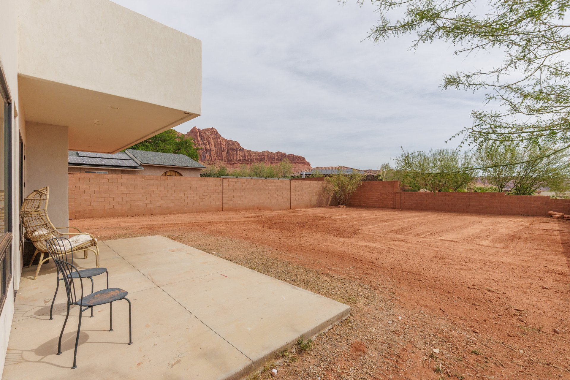 Fenced backyard featuring a patio