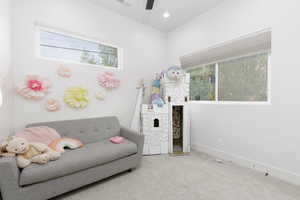 Living area featuring carpet flooring and recessed lighting
