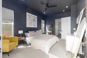 Bedroom featuring light carpet, ensuite bath, recessed lighting, and ceiling fan