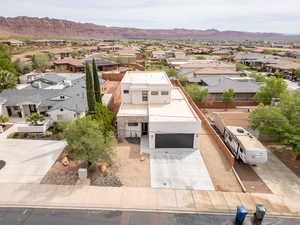 Aerial perspective of suburban area with a mountainous background