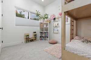 Carpeted bedroom featuring baseboards and recessed lighting