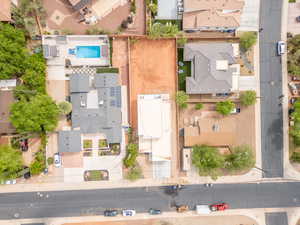 Aerial view of residential area featuring a pool area