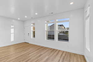 Unfurnished room with recessed lighting and light wood-style floors