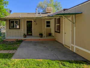 View of front facade with a gate and a patio area