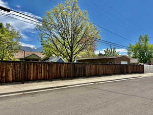 Fully Fenced with entrance to the Brick Shop Garage door entry