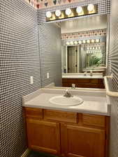 Basement Bathroom w/Separation Door between Vanity and Tub