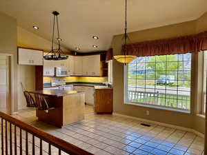 Kitchen w/Tile and Island w/suspended seating! Large Dining Area/Bay Windo