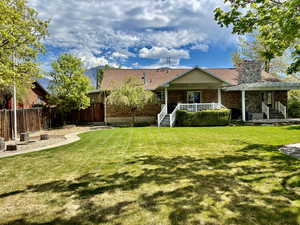 Back of the home and backyard