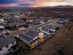 Aerial view at dusk of a residential view and a mountain view