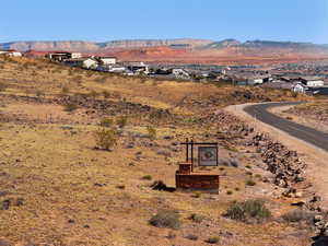 View of mountain backdrop featuring nearby suburban area