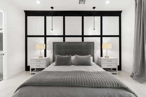 Bedroom with recessed lighting and baseboards