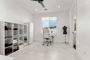 Office area featuring ceiling fan, light marble finish flooring, and recessed lighting