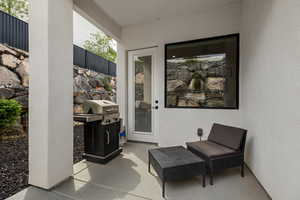 Property entrance featuring a patio and stucco siding