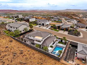 Aerial perspective of suburban area with a mountain backdrop